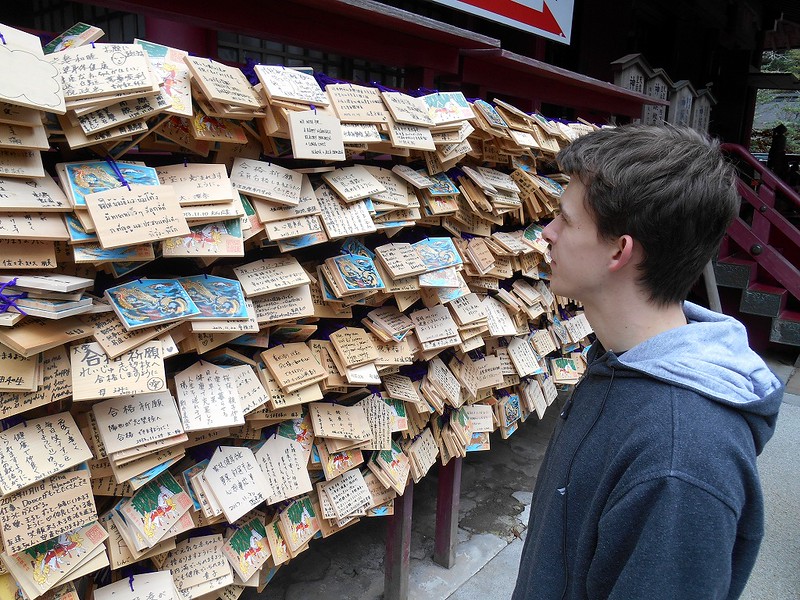 KCP student in front of temple wishes