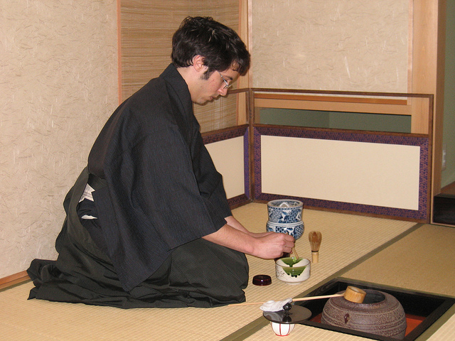 KCP student preparing tea equipment.