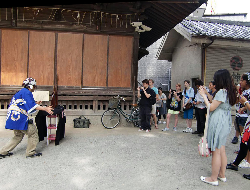 KCP students watching kamishibai (paper drama).