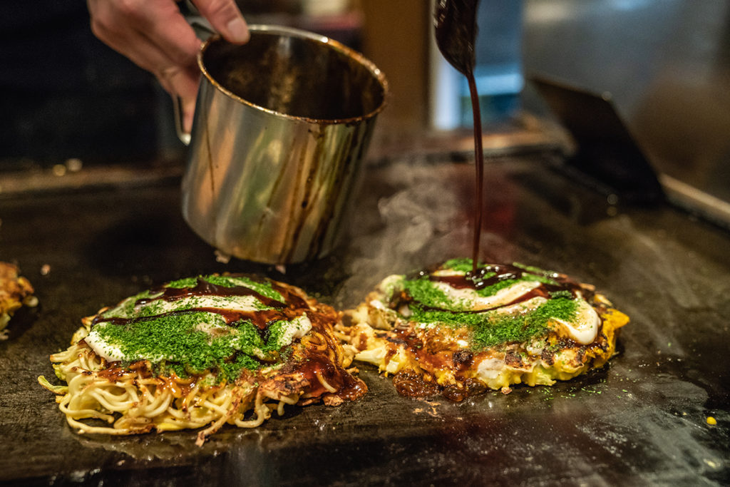 Preparing okonomiyaki