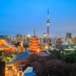 View of Tokyo skyline with Senso-ji Temple and Tokyo skytree at twilight.