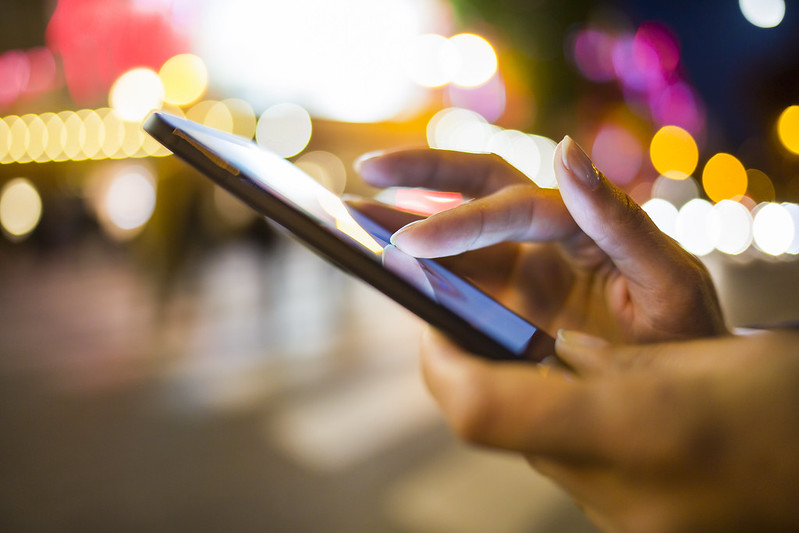 Woman using her Mobile Phone