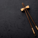 Chopsticks on dark table