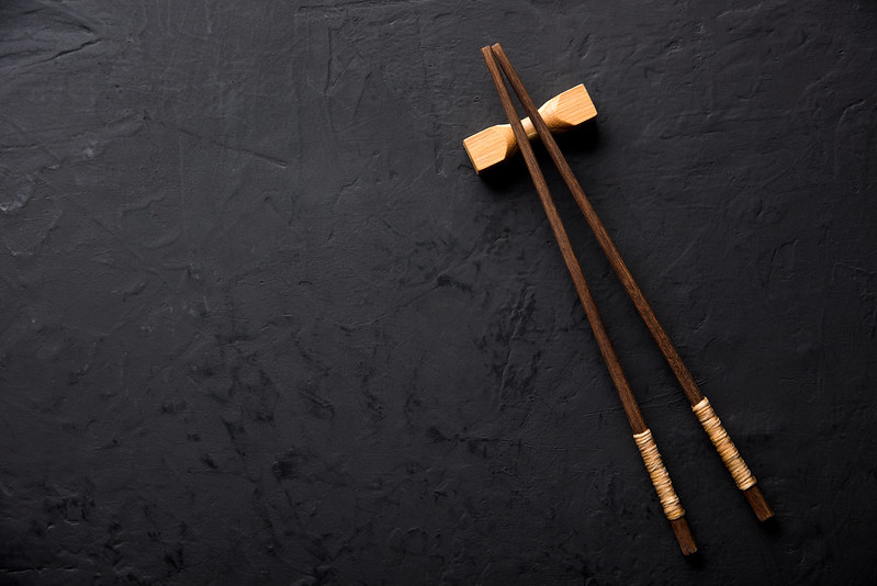 Chopsticks on dark table