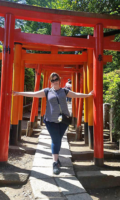 KCP International Language School Student Poses At the torii gates at Nezu Shrine