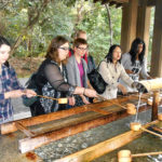 KCP students doing a cleansing ritual in a temple.