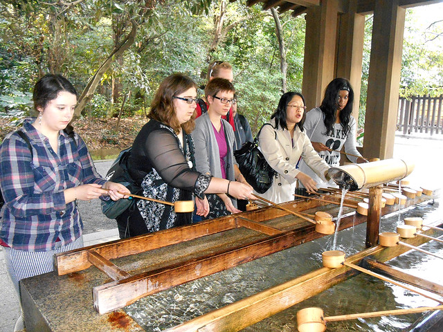 KCP students doing a cleansing ritual in a temple.