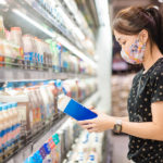 lady shopping for milk at a Japanese grocery store