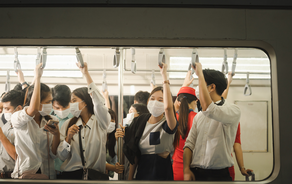 People in train with face masks