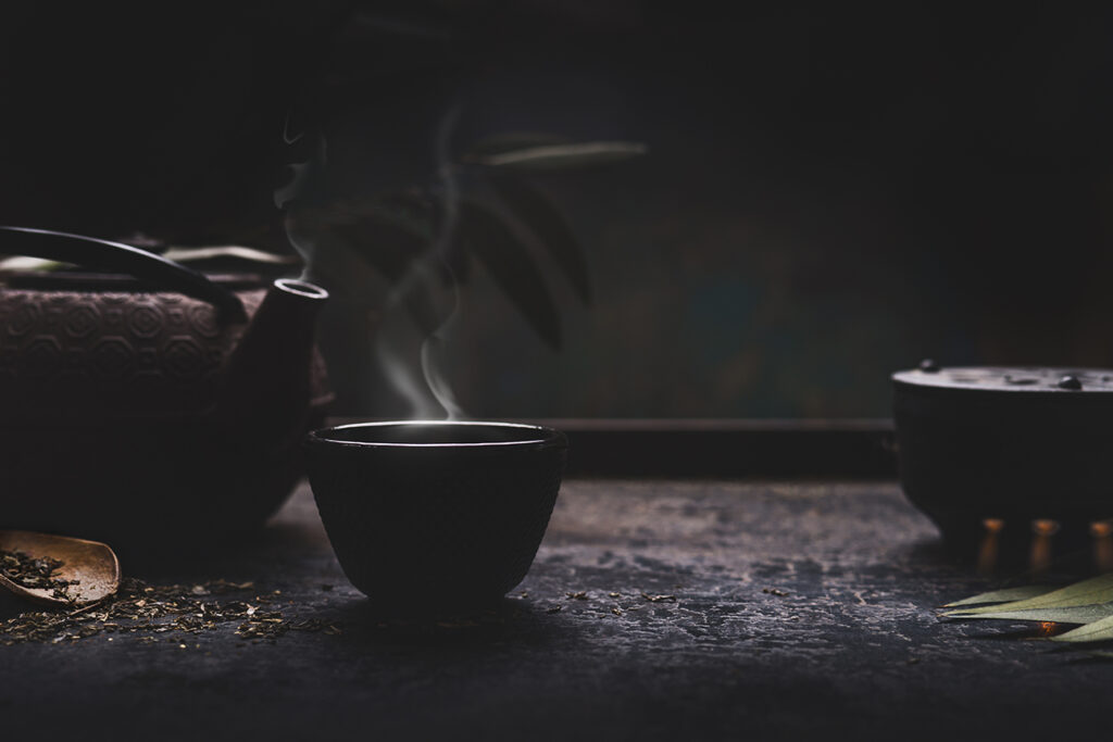 Steaming tea on black