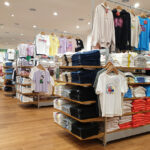 PENANG, MALAYSIA - 18 MAR 2021: Interior view of Uniqlo store in a shopping mall, Penang. Uniqlo Co., Ltd. is a Japanese casual wear designer, manufacturer and retailer.