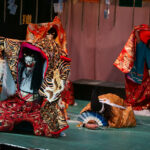 3 Japanese demons bullying an innocent man in Kagura performance. "贈" means present.