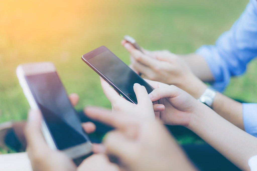 Hand of group business people using while reading smartphone. Portrait of Hand of group business people reading message with smart phone in outdoor.