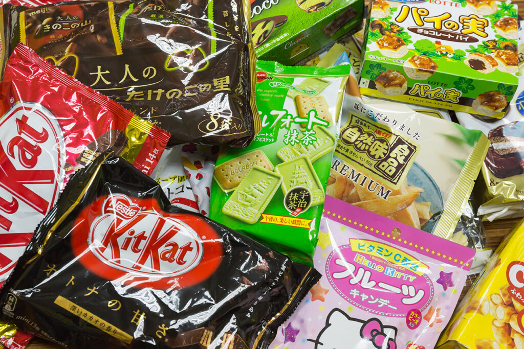 TOKYO, JAPAN - FEBRUARY 16, 2013: Japanese Sweets Snack in Narita airport duty free shop green tea matcha, sakura-matcha, and chocolate Kit Kat, Hello Kitty, Lotte is most popular for tourist