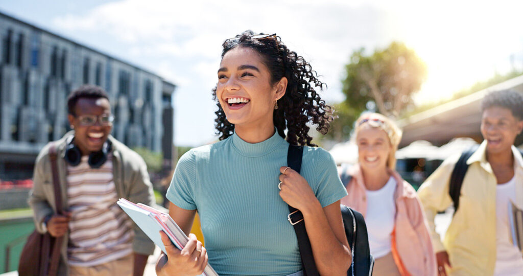 Young woman headed off to school with other students inthe back