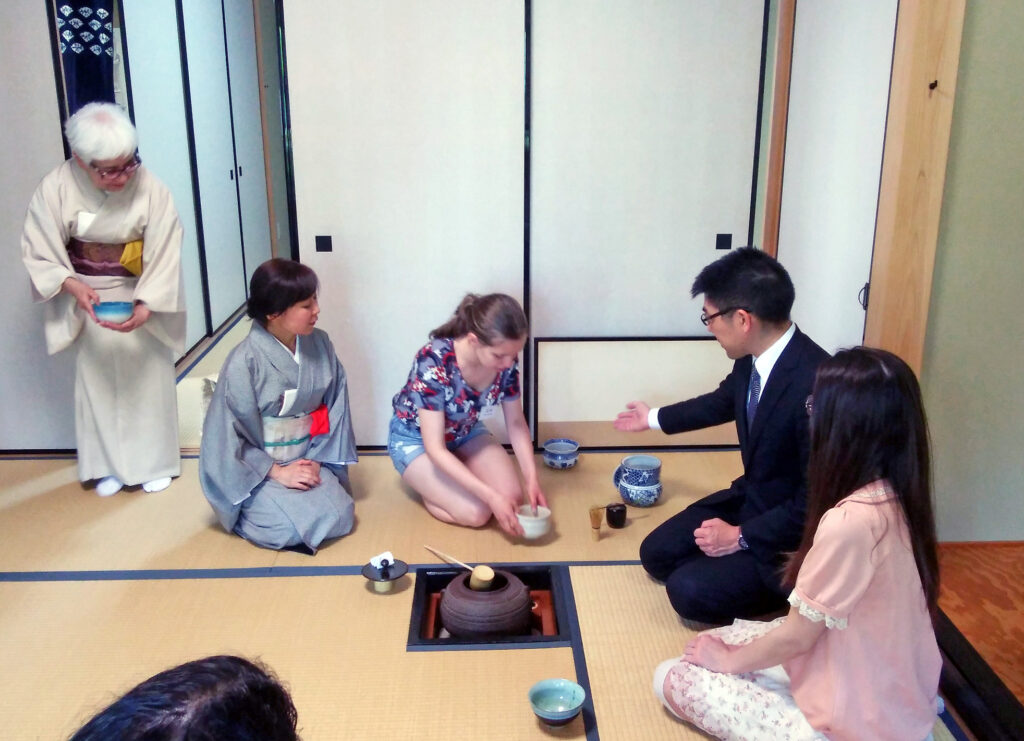 Students attend a tea ceremony session at KCP International's chashitsu.