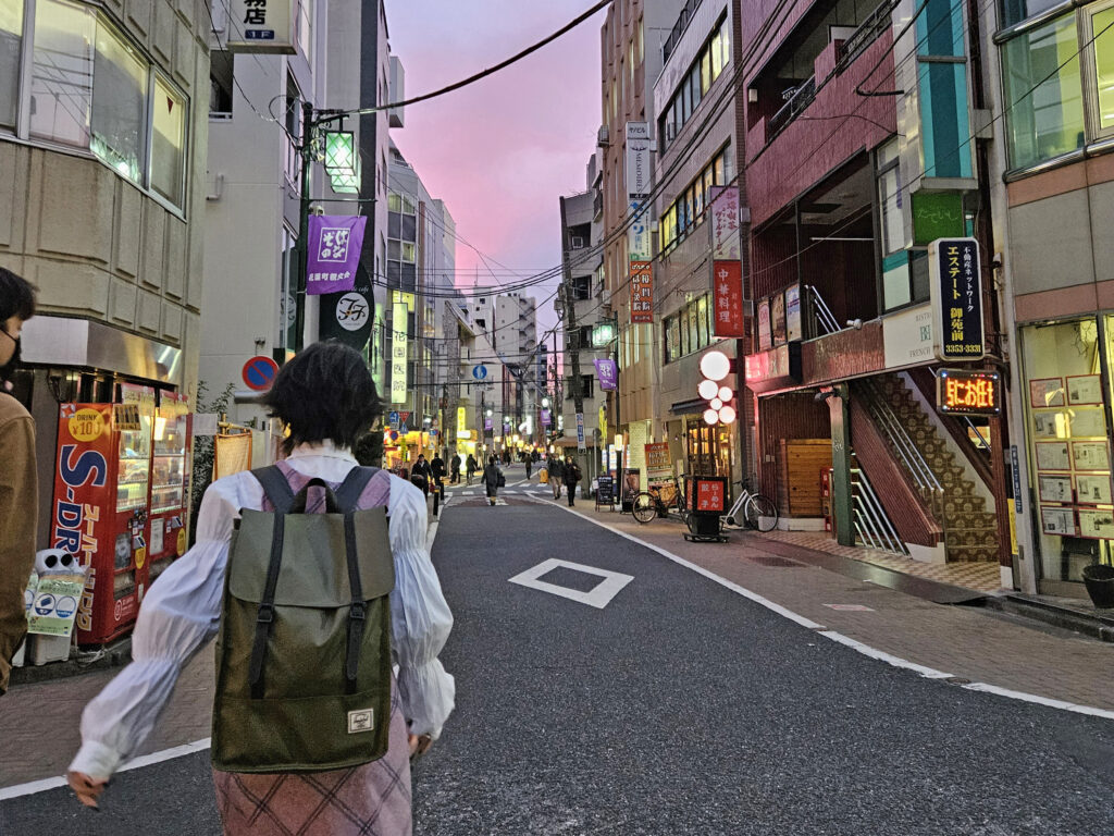 KCP International student walking down Tokyo street.