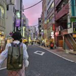 KCP International student walking down Tokyo street.