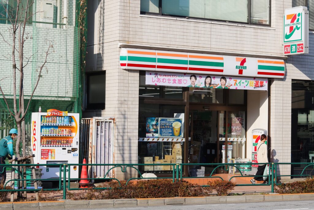 an image of 7/11 storefront with a vending machine beside it