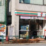 an image of 7/11 storefront with a vending machine beside it